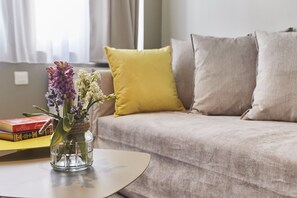 Apartment, 1 Bedroom (1st Floor) | Living room | Flat-screen TV