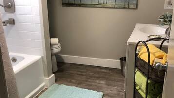 Combined shower/tub, hair dryer, towels, soap