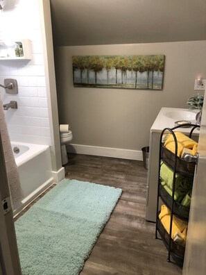 Combined shower/tub, hair dryer, towels, soap