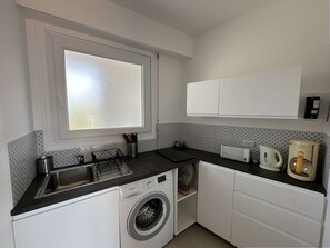 Fridge, microwave, cookware/dishes/utensils