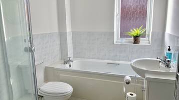 Apartment | Bathroom | Separate bathtub and shower, hair dryer, slippers, towels