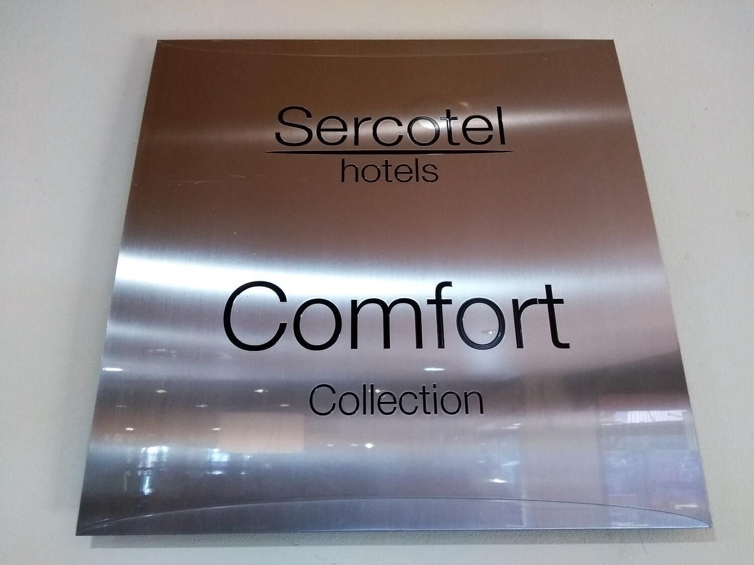 A sign for 'Sercotel hotels Comfort Collection'.