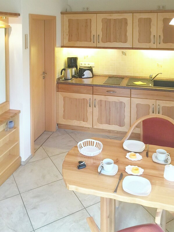 Fridge, microwave, stovetop, coffee/tea maker