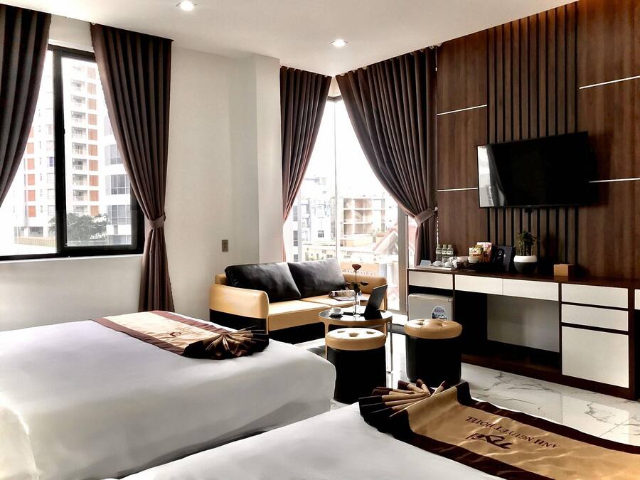Quarto triplo luxo | Frigobar, escrivaninha, Wi-Fi de cortesia, roupa de cama