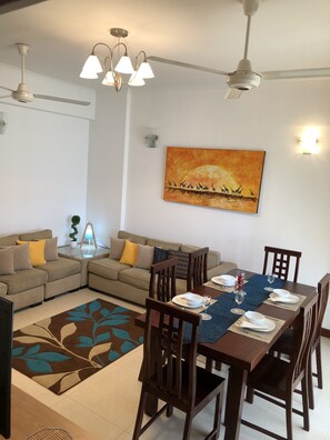 Exclusive Apartment, Multiple Beds, City View | Living area | Flat-screen TV