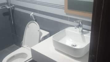 Shower, free toiletries, slippers, towels