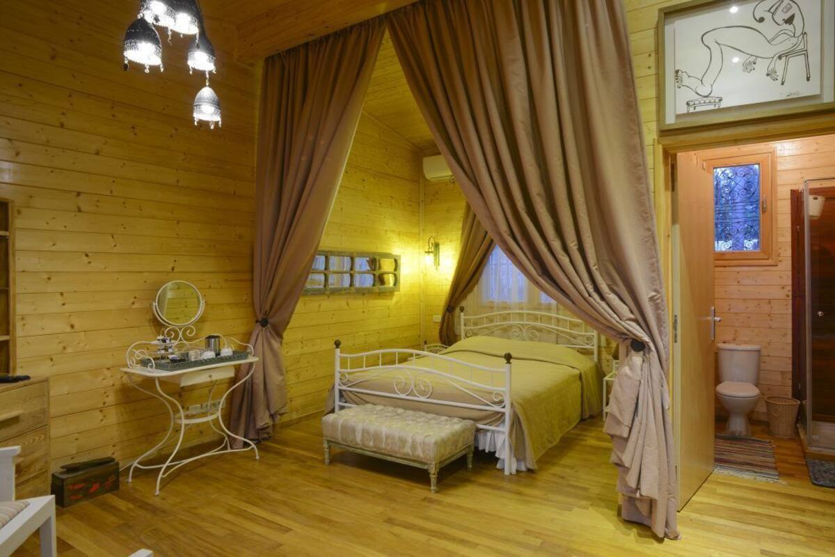 Suite Deluxe, no fumadores, vistas al jardín | 1 dormitorio, sábanas de algodón egipcio, ropa de cama de alta calidad