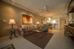 Condo (Shamron Beach 507) | Living room | TV, books - Shamron Beach Condo 507 (Fort Myers Beach)