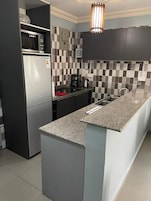 Full-sized fridge, microwave, coffee/tea maker, electric kettle