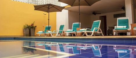 Outdoor pool, open 9:00 AM to 9:00 PM, pool umbrellas, sun loungers