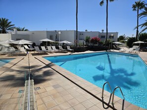 Outdoor pool, open 9:00 AM to 8:00 PM, sun loungers