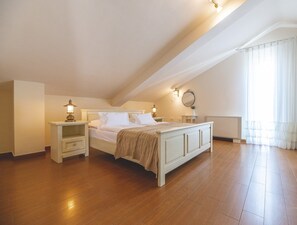 A bedroom with a bed, bedside tables, a nightstand, a mirror, and a window with curtains. - Stylish apartment Luce 3***** by the sea on Krk (Malinska)