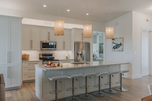 Fridge, microwave, oven, stovetop - Modern Island Luxury | 4 En-Suite Masters, 6 BA, Pool, Dock & Outdoor Oasis (Key Colony Beach)