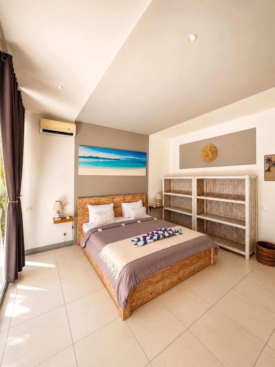 A bedroom with a bed, a nightstand, a wall-mounted air conditioner, a bookshelf, and a painting.