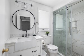 Combined shower/tub, hair dryer, towels, soap