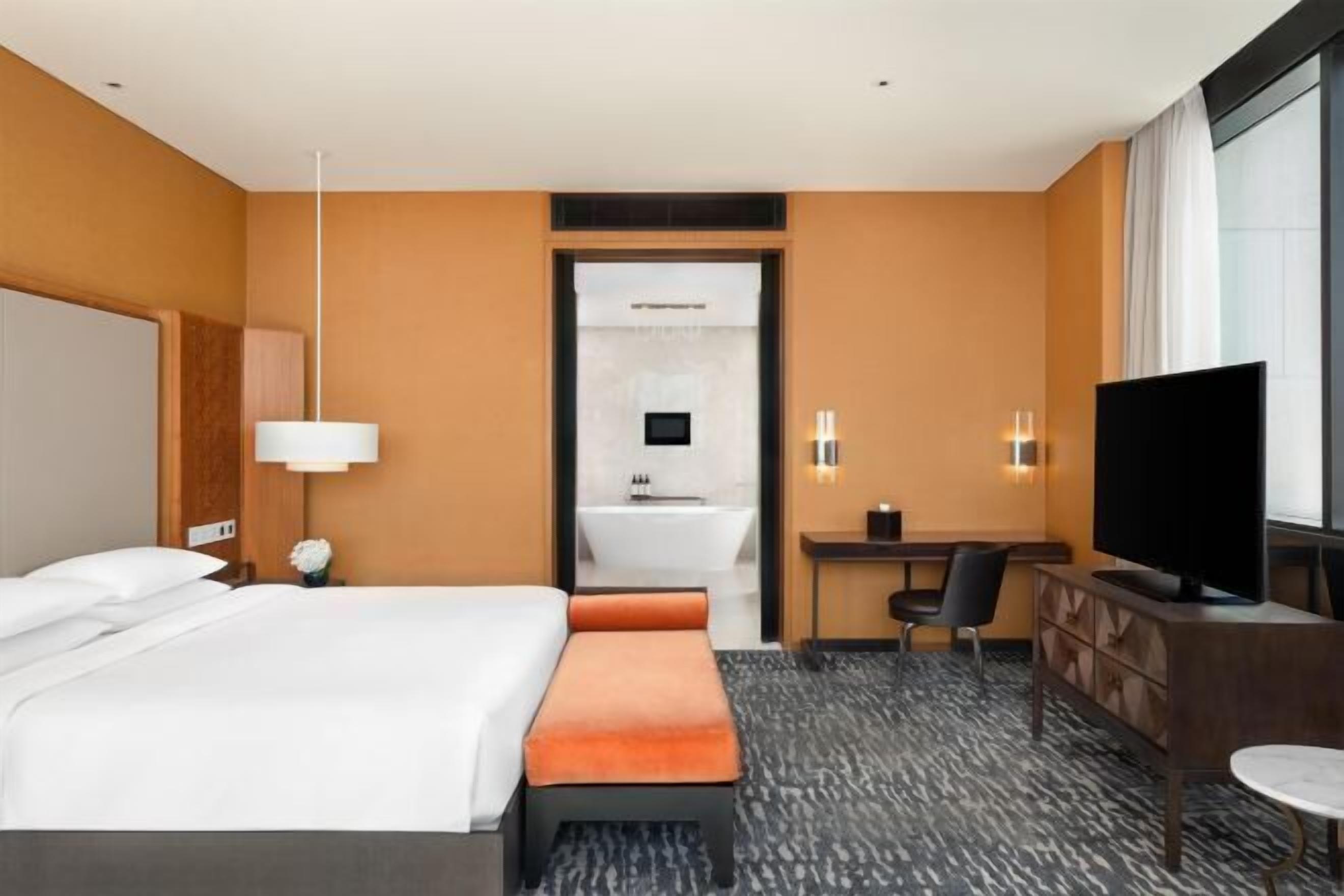 Premium bedding, down comforters, minibar, in-room safe