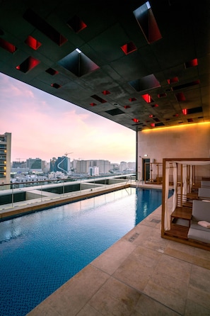 Outdoor pool, open 8:00 AM to 8:00 PM, free pool cabanas, pool loungers