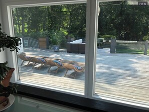 A deck with lounge chairs and a fire pit. - Resort Style Home- Family Friendly (Shelter Island)