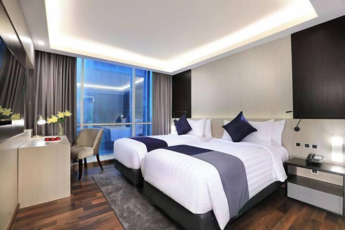 Luxe beddengoed, een minibar, een kluis op de kamer, een bureau