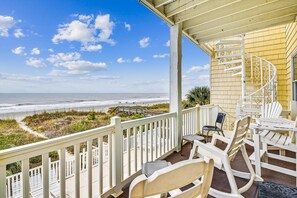 A balcony with white railings overlooking a beach. - Seaclusion A - Ocean Front 5,000sq foot Luxury 8 bedroom duplex w/Pool (NORTH MYRTLE BEACH)