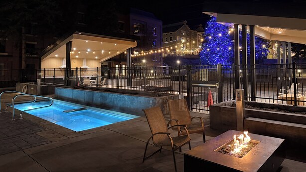 An outdoor pool area with a hot tub, seating, and a fire feature. - 224-A Studio/Main St/Town Lift/Pool/Hot Tub/Parking  (Park City)