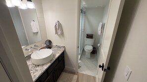 Combined shower/bathtub, hair dryer, towels, soap