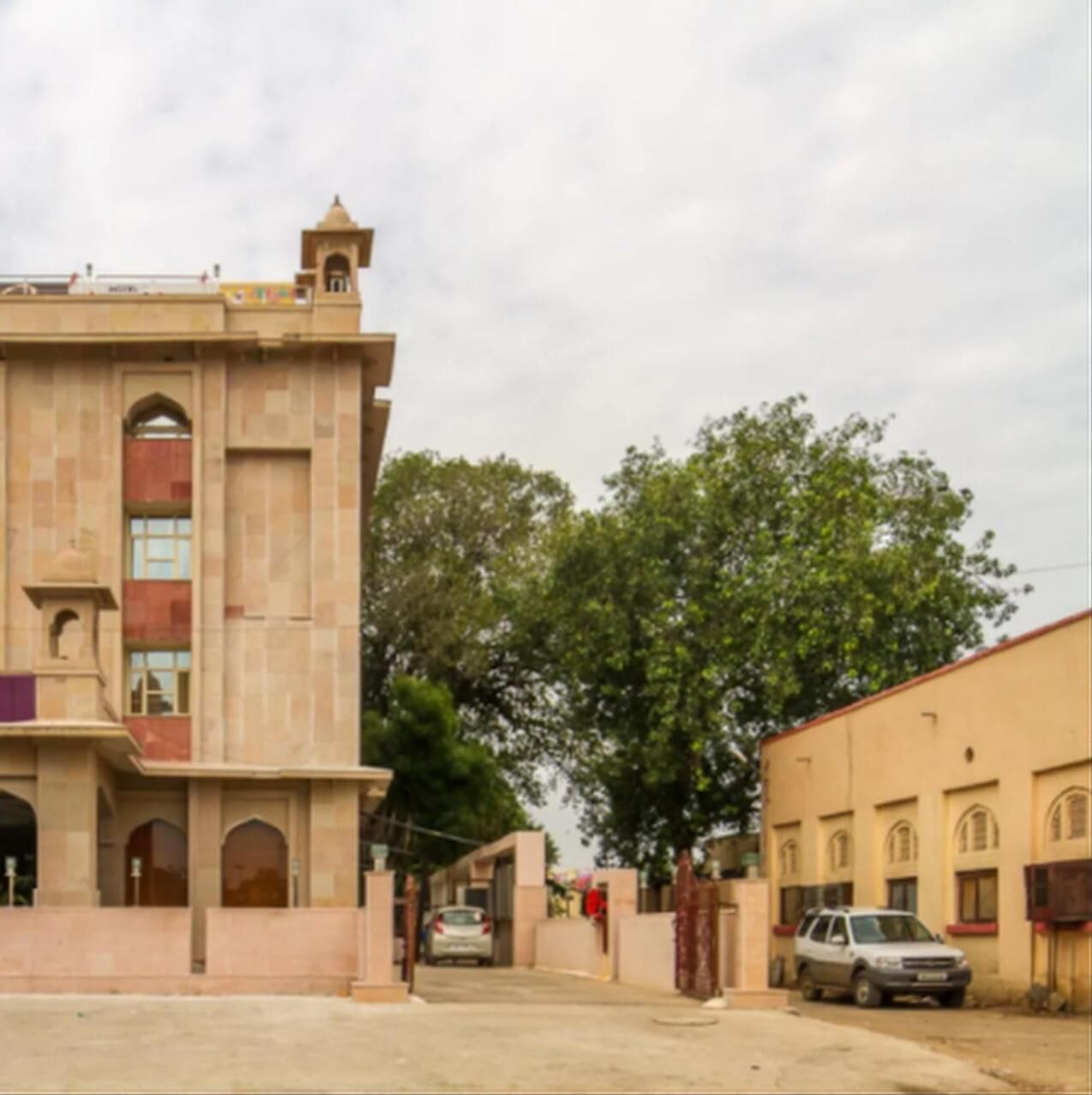 A building with a traditional architectural style, featuring arched windows and a central tower.
