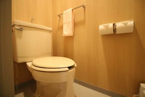 A standard hotel bathroom with a toilet, a towel rack, and a toilet paper holder. - F apt 202 Mickey House SHIBUYA SHINJUKU (Tokyo)
