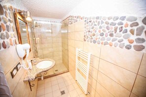 Shower, free toiletries, hair dryer, slippers