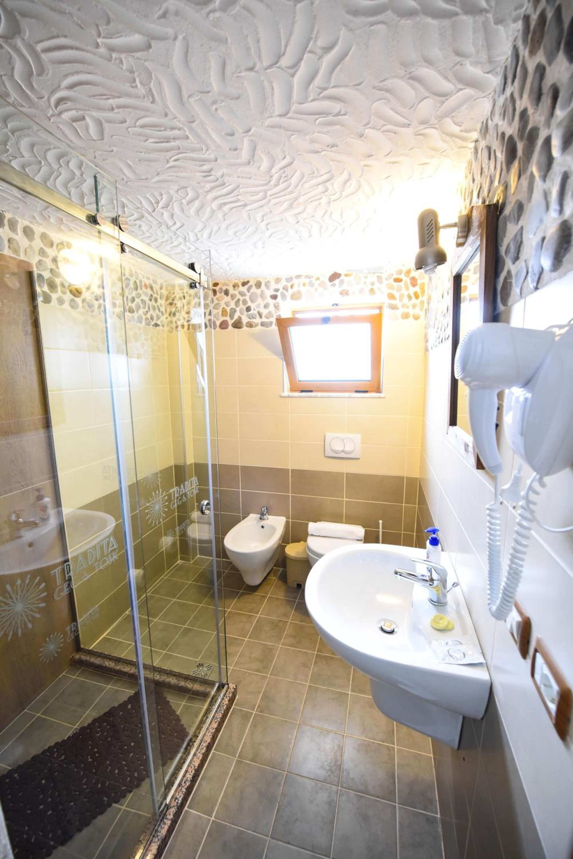 shower, free toiletries, hair dryer, slippers