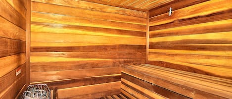 A sauna with wooden walls and benches.