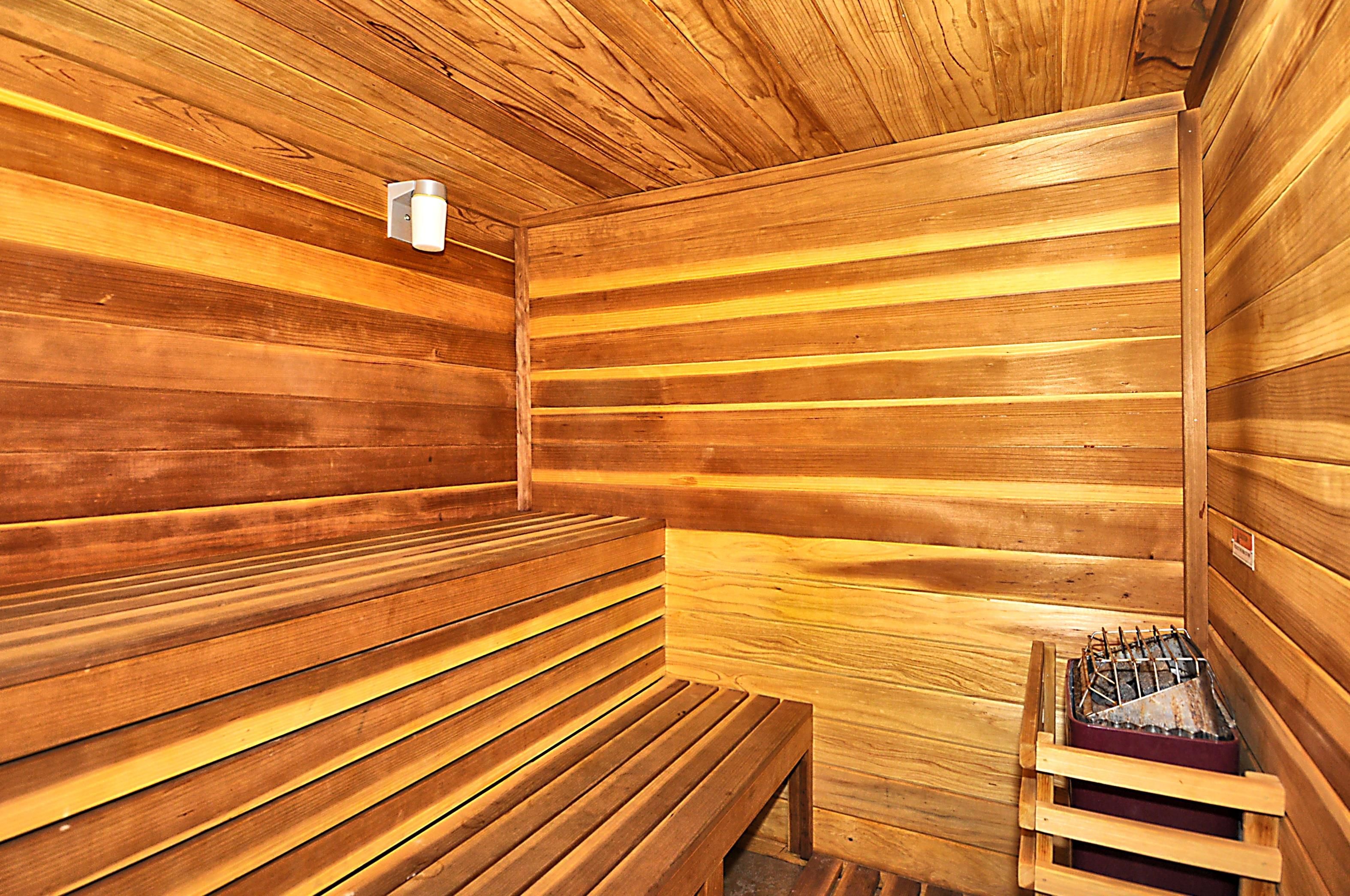 A sauna with wooden benches and a bench seat.