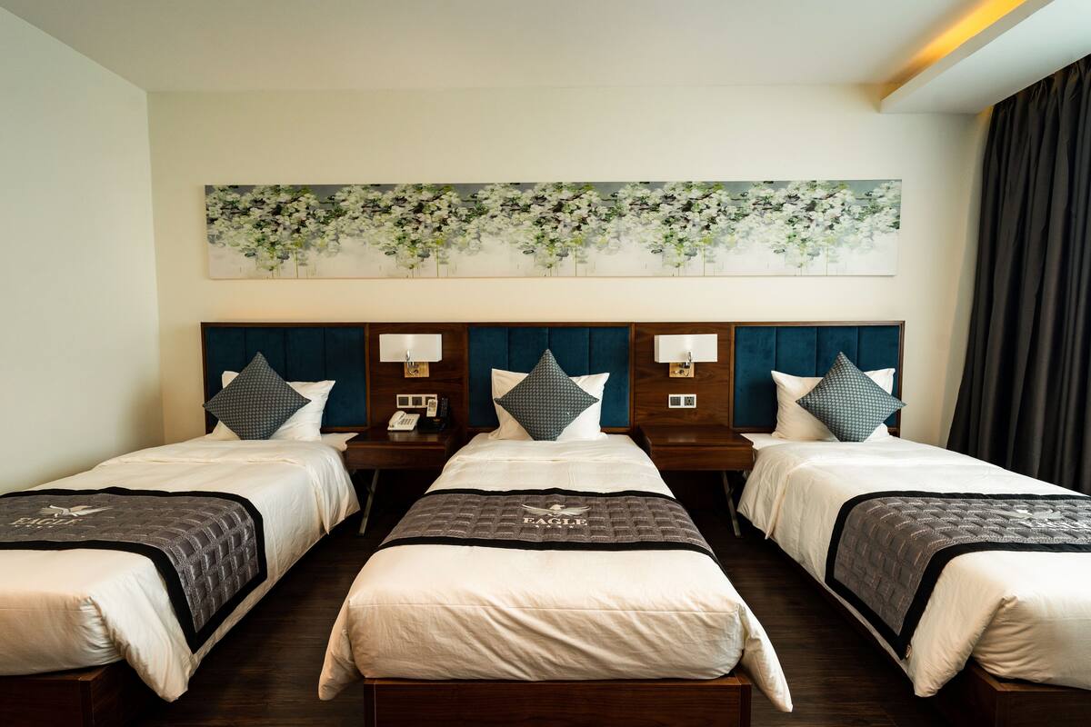 Deluxe Triple Room, City View | 1 bedroom, minibar, in-room safe, desk