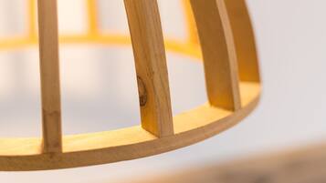 A close-up of a wooden chair with a circular backrest.