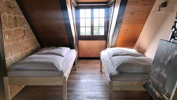 1 bedroom, desk, iron/ironing board, travel crib