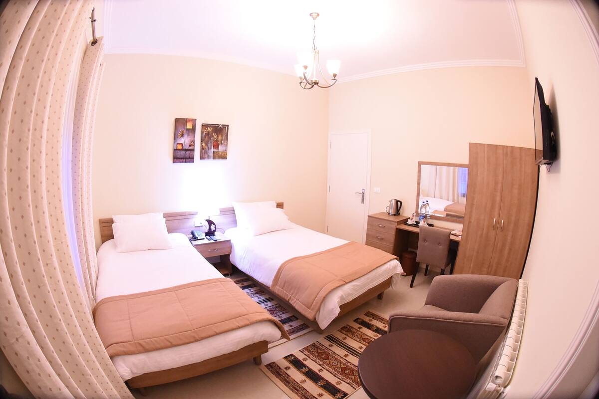 Twin Room, Mountain View | Minibar, in-room safe, desk, iron/ironing board