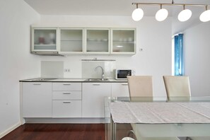 Luxury Apartment, 1 Bedroom, Balcony (3) | Private kitchen | Fridge, stovetop, coffee/tea maker, electric kettle