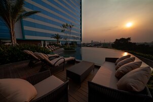 Outdoor pool, open 6:00 AM to 7:00 PM, sun loungers