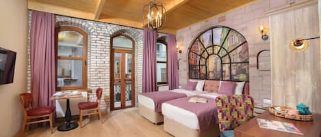 Standard Studio Suite | Minibar, in-room safe, individually decorated, desk