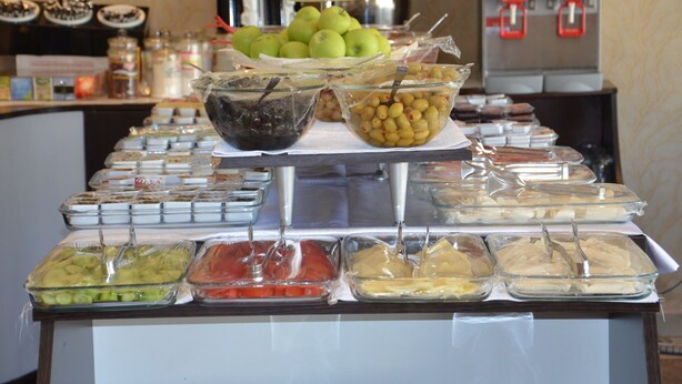A buffet with various food items and a coffee machine in the background. - Admiral Hotel (Kocasinan)