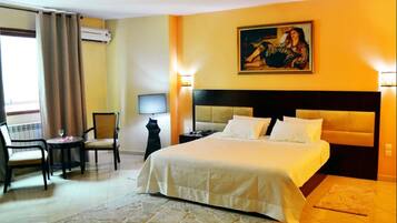 Double or Twin Room | Minibar, in-room safe, desk, blackout drapes