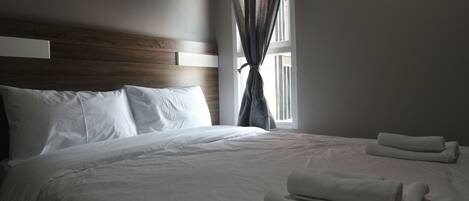 Desk, blackout curtains, iron/ironing board, rollaway beds