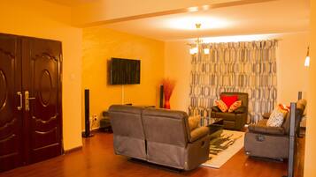 Appartement, plusieurs lits | Coin séjour