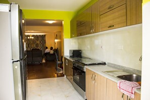 Apartment, Multiple Beds | Private kitchen | Full-size fridge, microwave, oven, stovetop - Exquisite Serviced Apartment (Nairobi)
