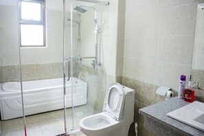 Apartment, Multiple Beds | Bathroom | Separate bathtub and shower, deep-soaking bathtub, free toiletries - Exquisite Serviced Apartment (Nairobi)