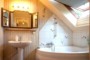 Bathtub, rainfall showerhead, hair dryer, bidet