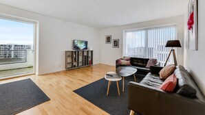 Apartment, Multiple Beds | Living room | Flat-screen TV