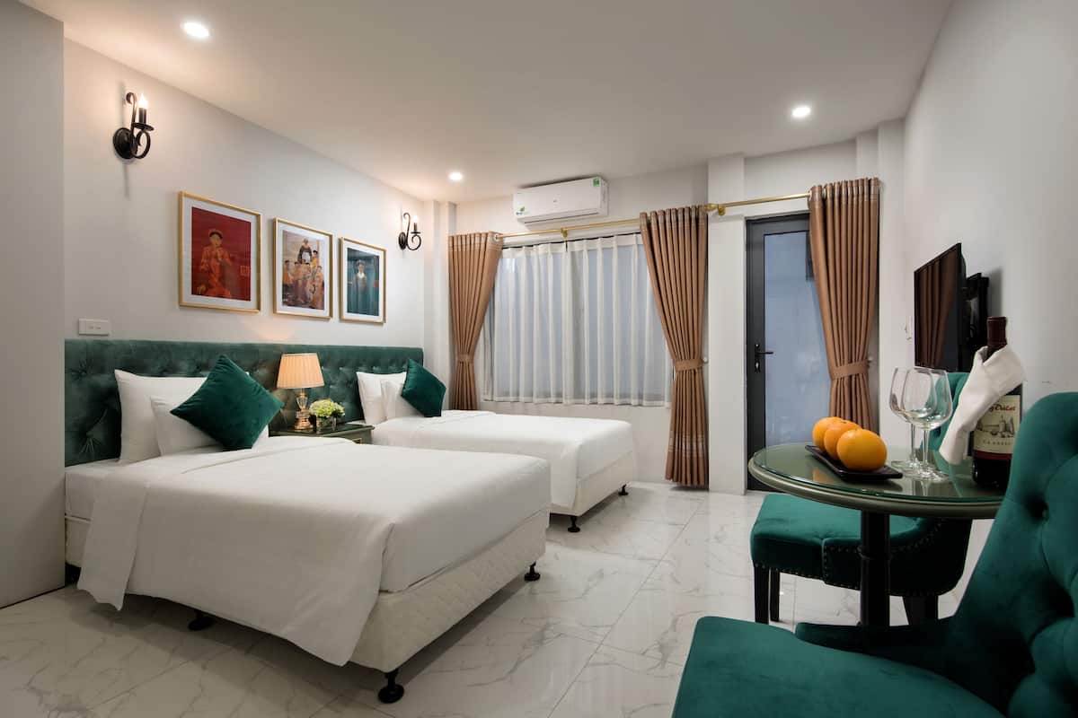 Deluxe Double or Twin Room | Minibar, in-room safe, desk, blackout drapes