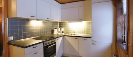 Fridge, stovetop, dishwasher, coffee/tea maker