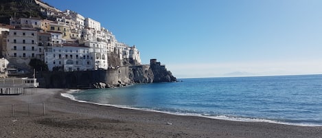 On the beach, sun-loungers, beach towels